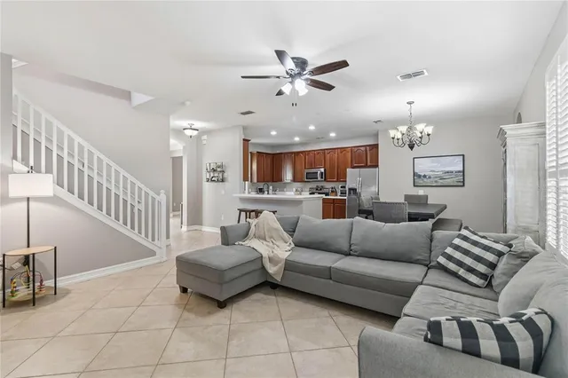 a kitchen with stainless steel appliances granite countertop a stove top oven a sink dishwasher and a microwave oven on the blue kitchen countertops