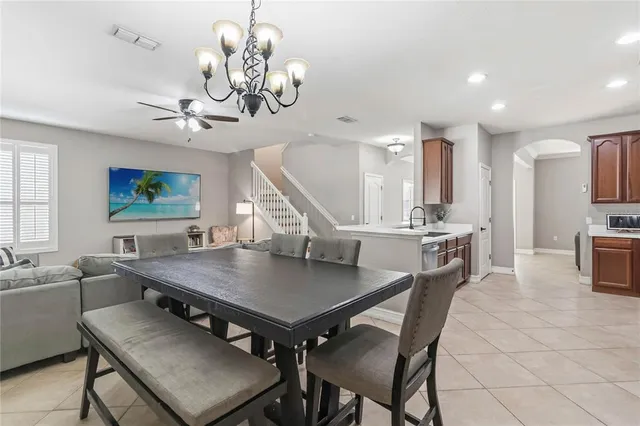 a bedroom with a bed and a dresser with a bookshelf