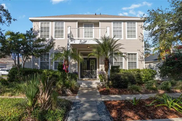 a view of a large trees with a house in the background