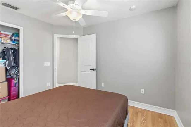 a view of a patio with a dining table and chairs with wooden floor