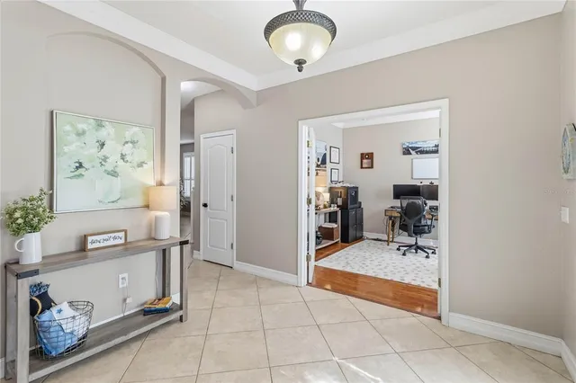 a view of a dining room with furniture and a chandelier