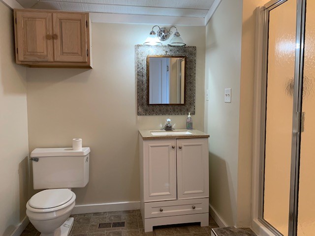 1217 17th Street Columbus, GA 31901 - Photo 12 of 20 a bathroom with a toilet sink and mirror