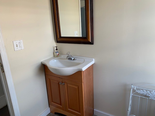 1217 17th Street Columbus, GA 31901 - Photo 16 of 20 a bathroom with a sink and a mirror