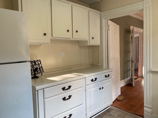 1217 17th Street Columbus, GA 31901 - Photo 8 of 20 a kitchen with white cabinets and a stove
