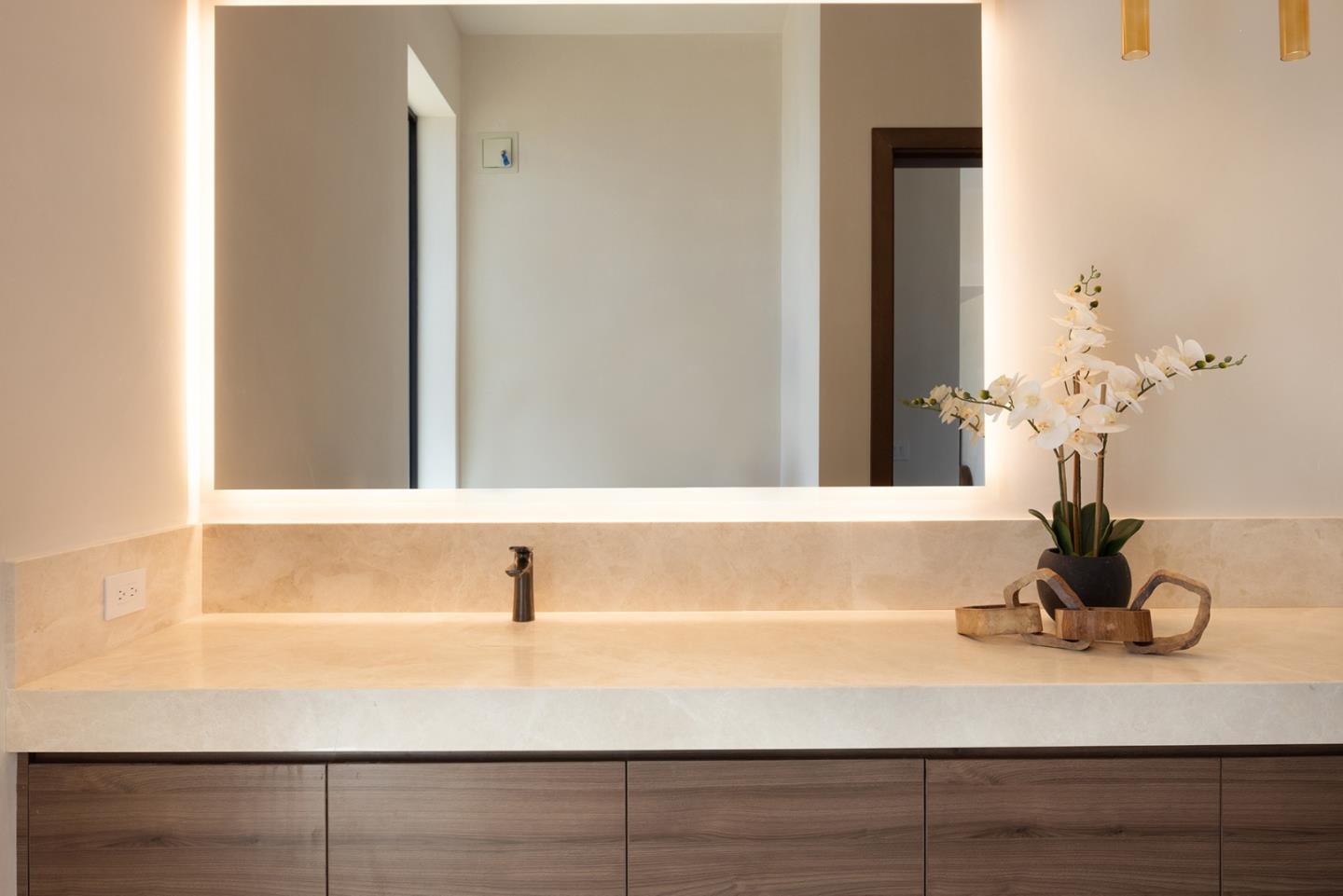 31 Poppy Lane Pebble Beach, CA 93953 - Photo 16 of 51 a bathroom with a sink and a mirror