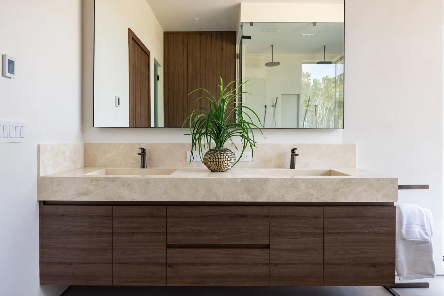 31 Poppy Lane Pebble Beach, CA 93953 - Photo 22 of 51 a bathroom with a granite countertop sink and a mirror