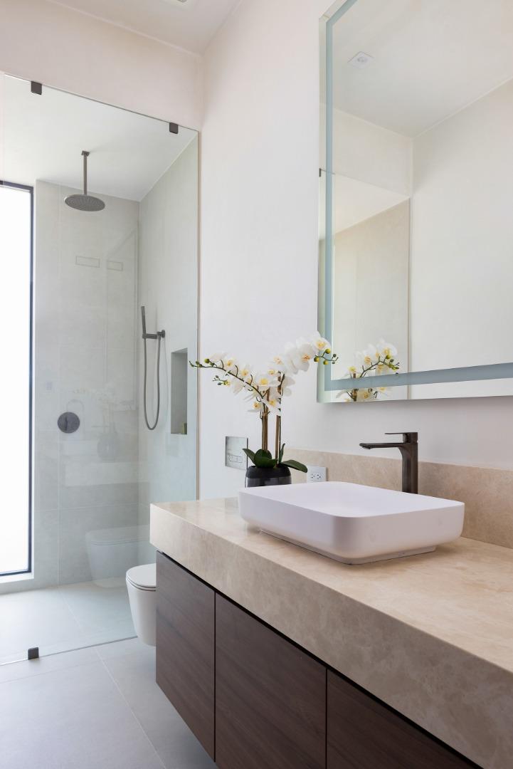31 Poppy Lane Pebble Beach, CA 93953 - Photo 28 of 51 a bathroom with a double vanity sink toilet and shower