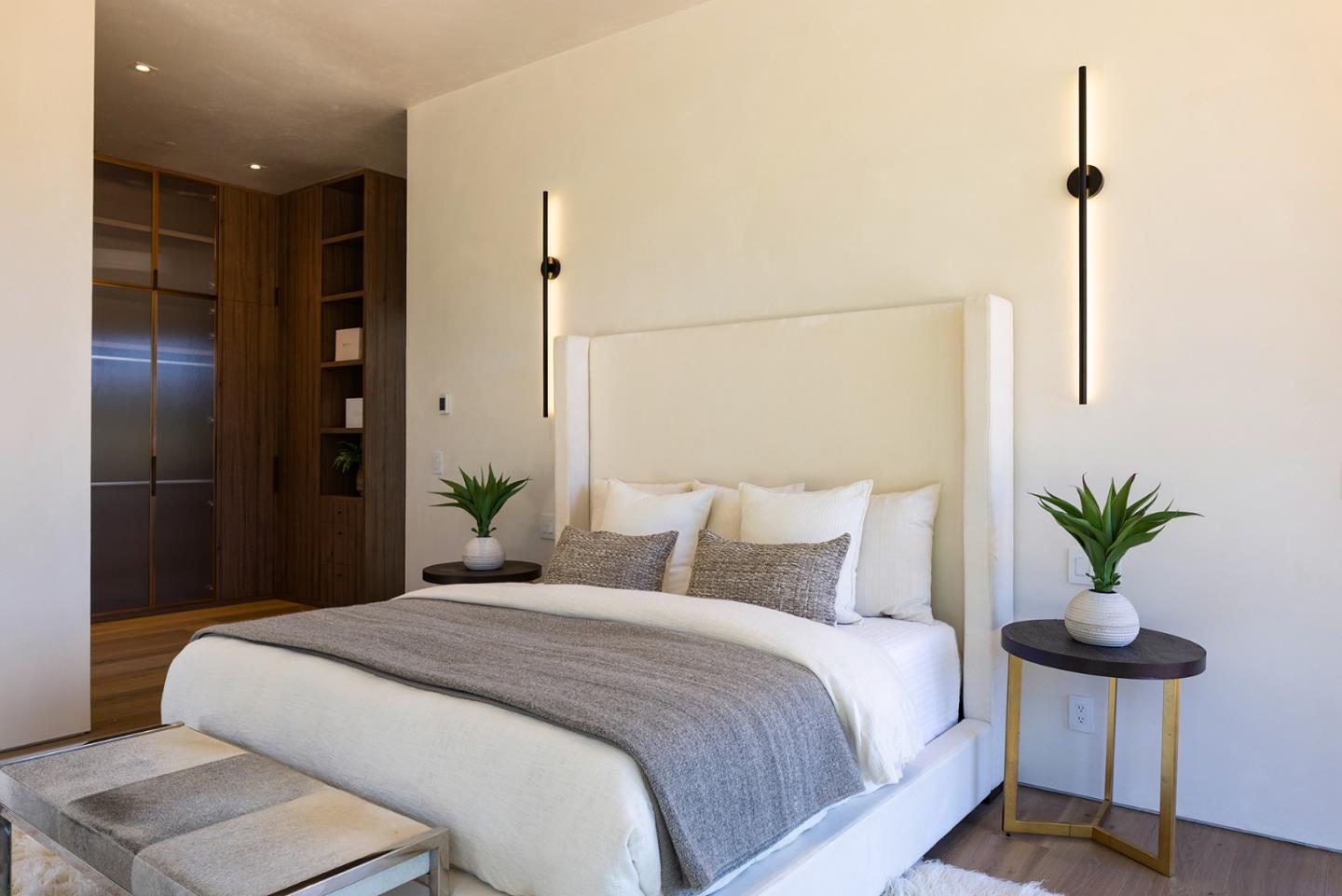 31 Poppy Lane Pebble Beach, CA 93953 - Photo 32 of 51 a bedroom with a large bed and a potted plant