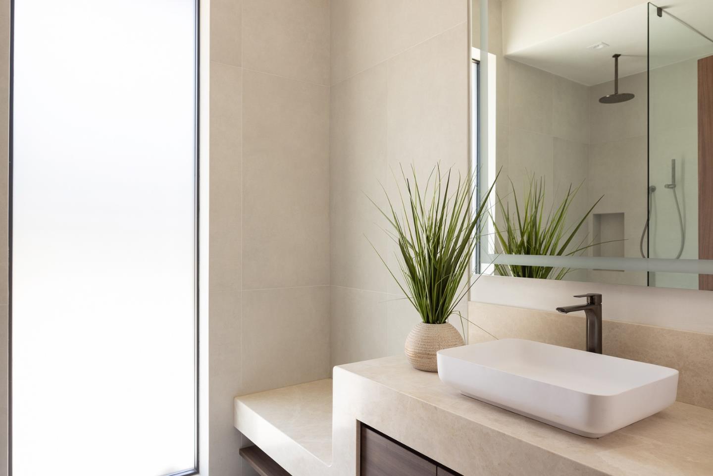 31 Poppy Lane Pebble Beach, CA 93953 - Photo 39 of 51 a bathroom with a sink a mirror and a shower