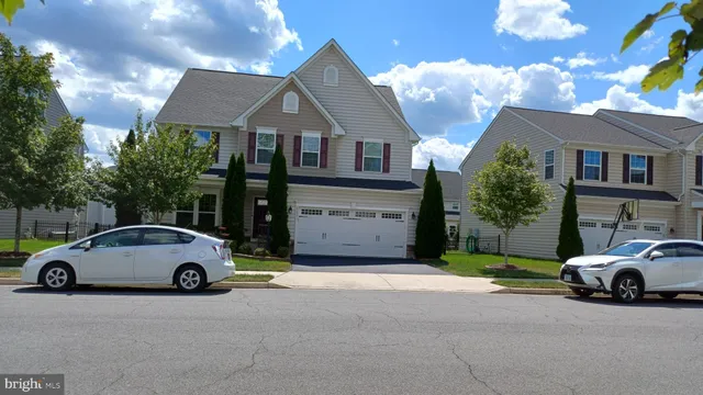 a view of a car parked in front of a house