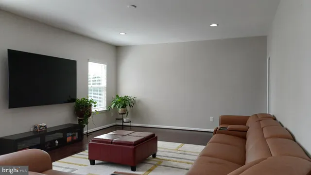 a view of entryway with stairs and wooden floor