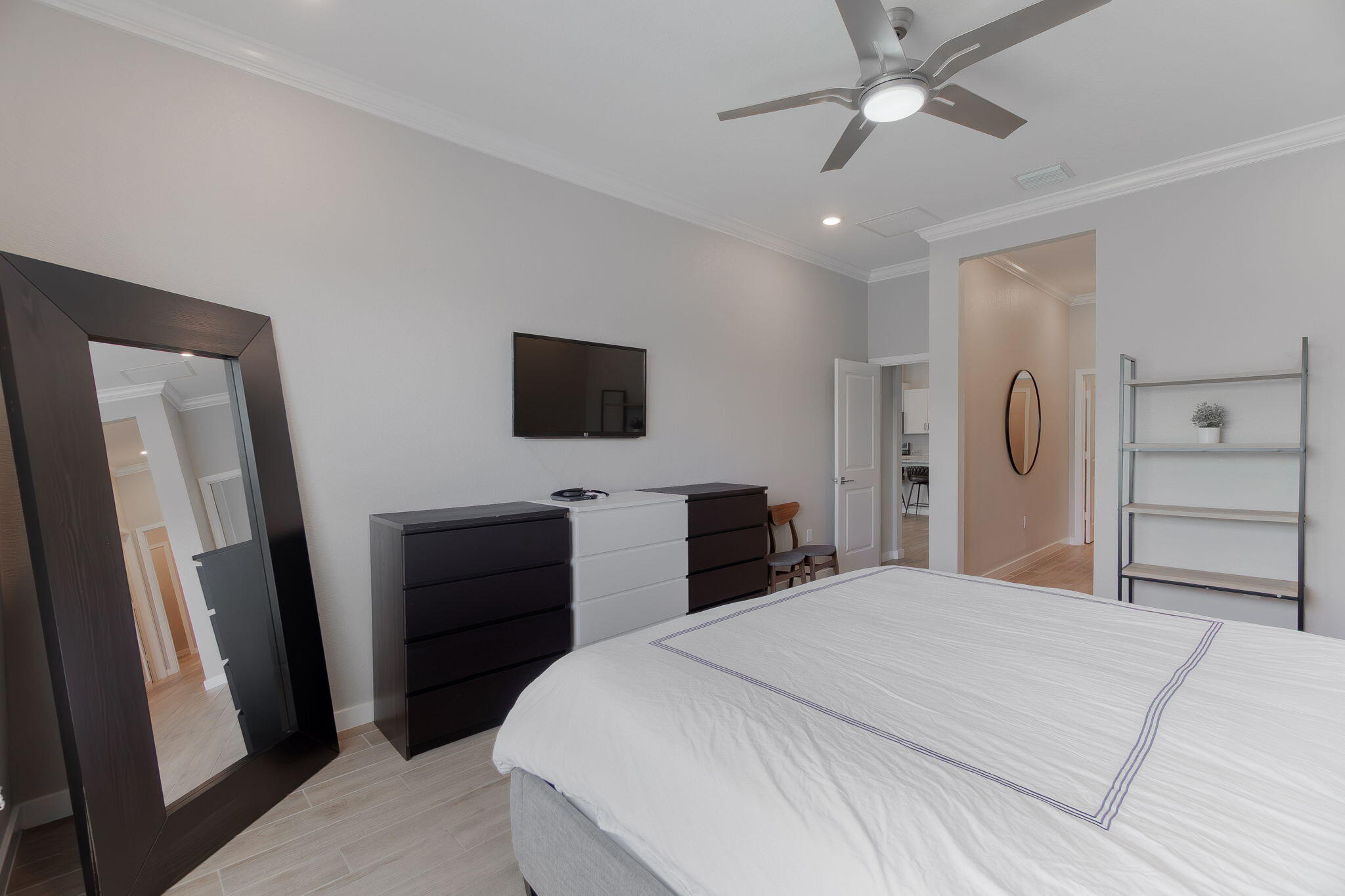 19546 Weathervane Way Loxahatchee, FL 33470 - Photo 26 of 63 a bedroom with a bed and a flat tv screen on dresser