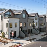 a front view of a house with many windows
