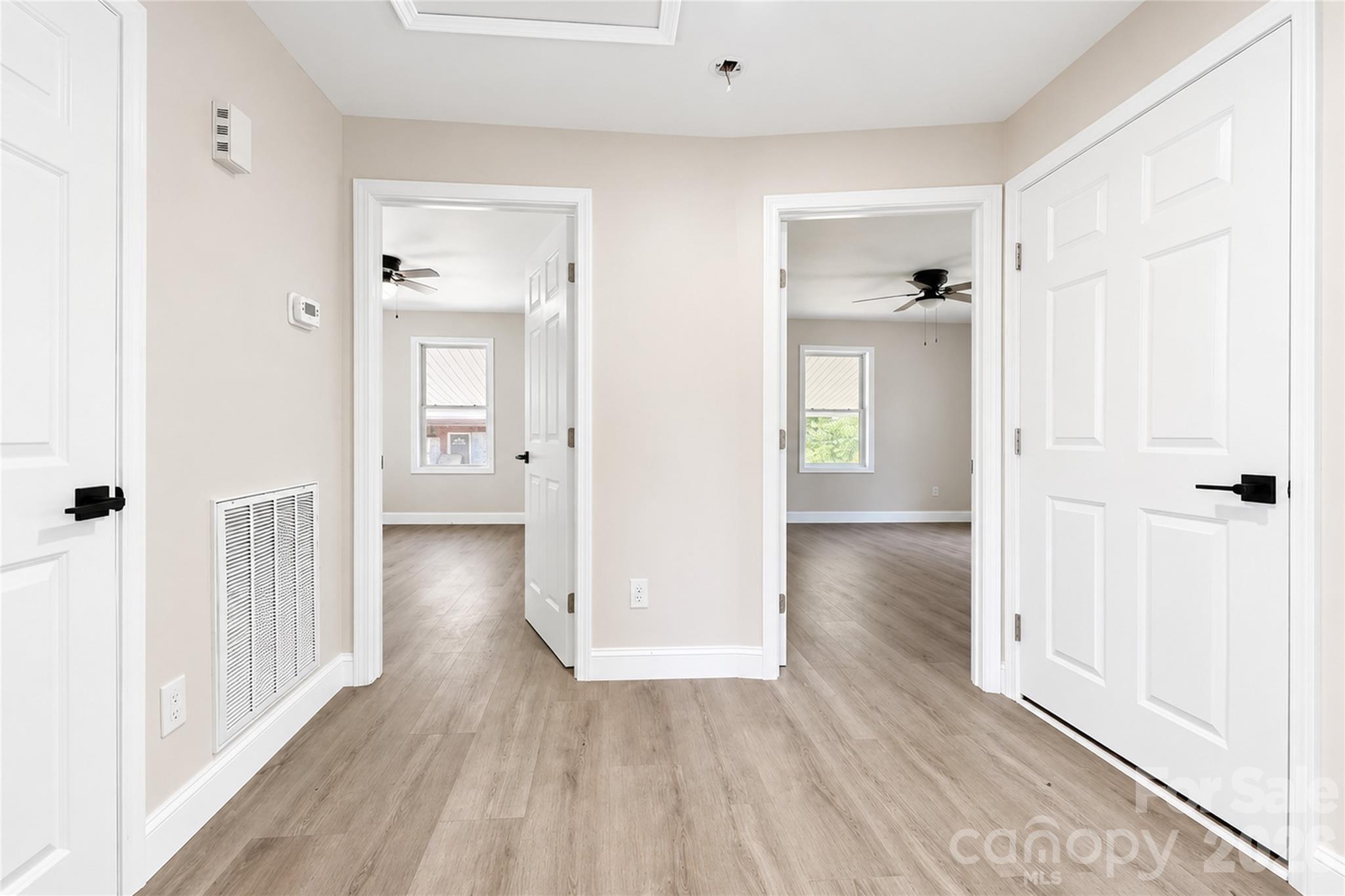 1403 Dudley Shoals Road Granite Falls, NC 28630 - Photo 16 of 34 a view of a hallway with wooden floor and closet