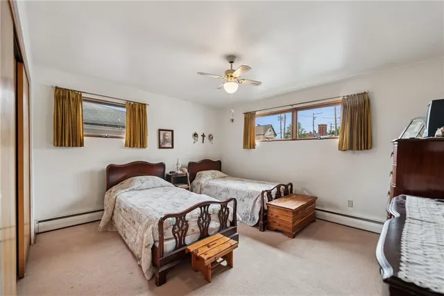 a bedroom with furniture and a window