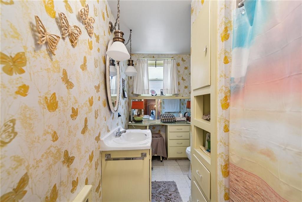 340 Weldon Street Latrobe, PA 15650 - Photo 17 of 26 a bathroom with a sink toilet and shower