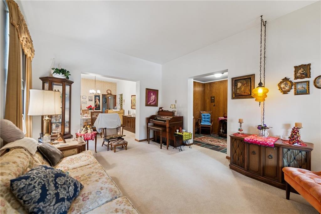 340 Weldon Street Latrobe, PA 15650 - Photo 5 of 26 a living room with furniture and a flat screen tv