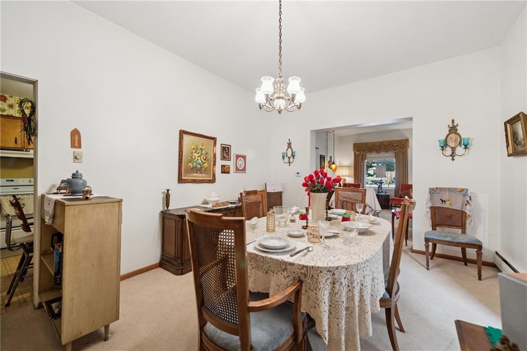 340 Weldon Street Latrobe, PA 15650 - Photo 7 of 26 a view of a dining room with furniture and a chandelier