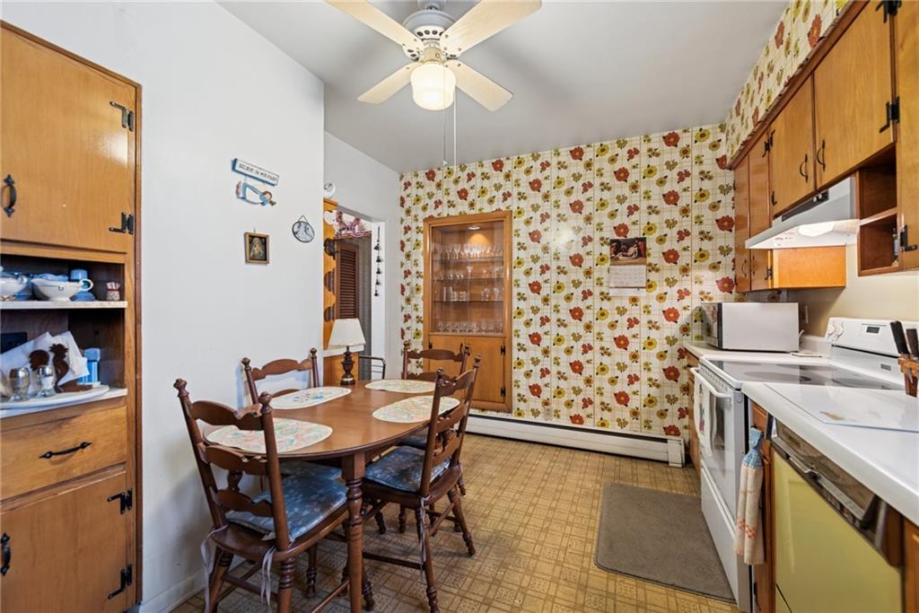 340 Weldon Street Latrobe, PA 15650 - Photo 10 of 26 a dining room with a wooden table and chairs