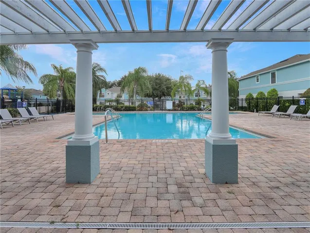 a view of a patio with a table and chairs