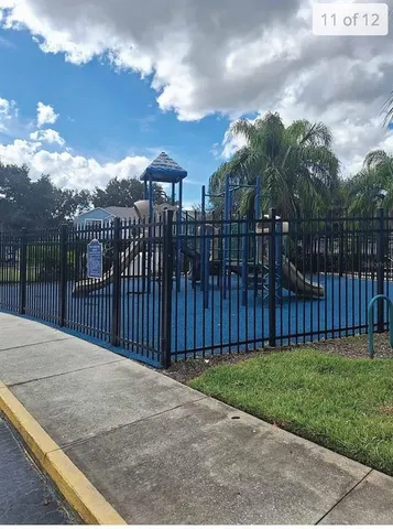 a view of a wrought iron fences in front of house