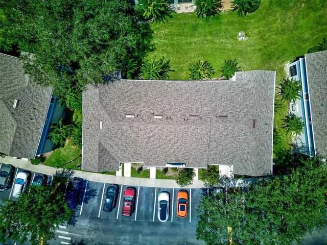an aerial view of multiple house with a yard
