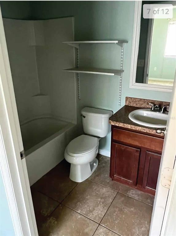 3321 Windleshore Way Sanford, FL 32773 - Photo 5 of 20 a bathroom with a sink a toilet and shower