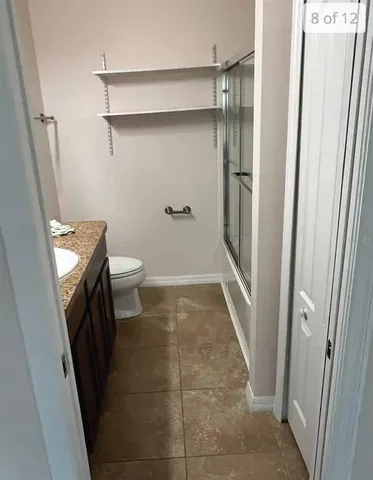 a bathroom with a sink and toilet
