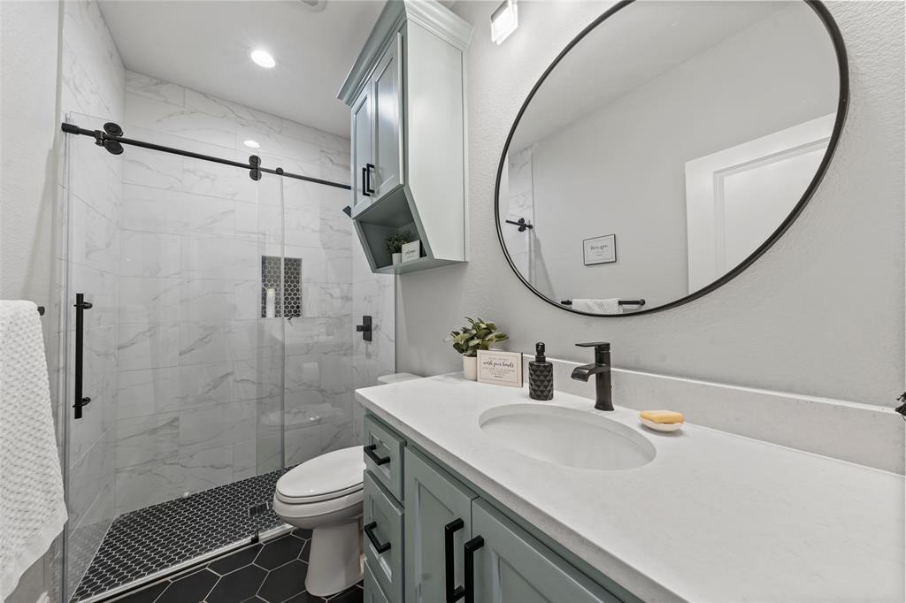 820 Forward Pass Drive Hewitt, TX 76643 - Photo 8 of 22 a bathroom with a sink a toilet and a mirror