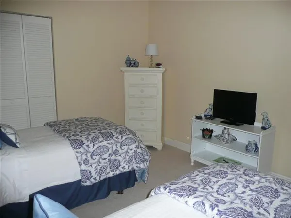 a bedroom with a bed and a television in it