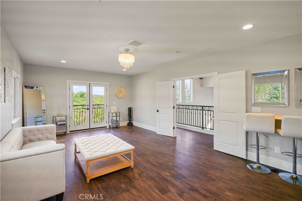 38149 De Luz Road Fallbrook, CA 92028 - Photo 12 of 36 a living room with furniture and wooden floor
