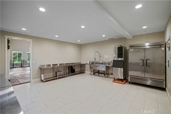 a large room with gym equipment and mirrors