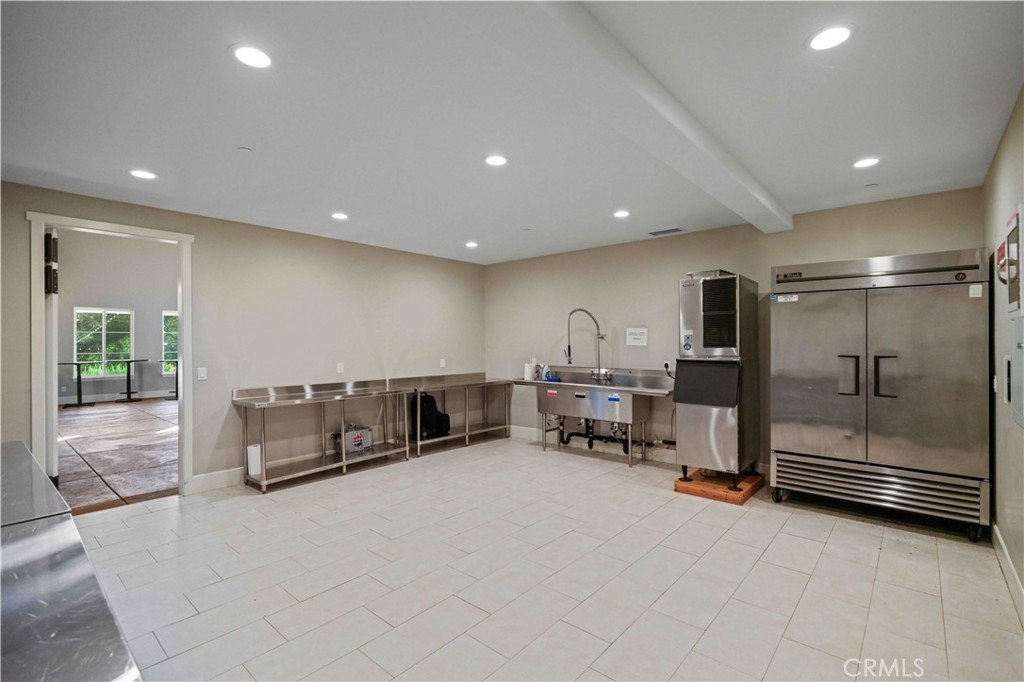 38149 De Luz Road Fallbrook, CA 92028 - Photo 13 of 36 a large room with gym equipment and mirrors