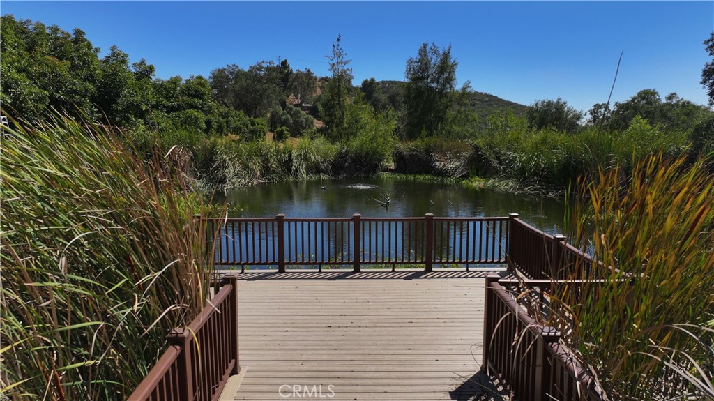 38149 De Luz Road Fallbrook, CA 92028 - Photo 16 of 36 a view of balcony with wooden floor and lake view