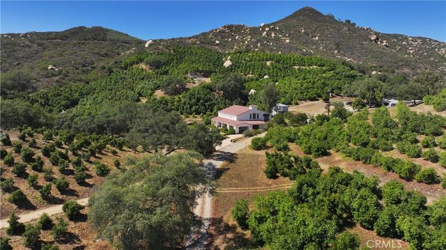 a view of a house with a field