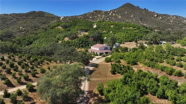 a view of a house with a field
