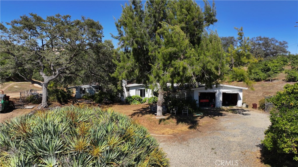 38149 De Luz Road Fallbrook, CA 92028 - Photo 19 of 36 a view of a house with a yard