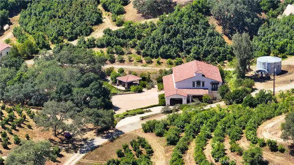 an aerial view of house with yard