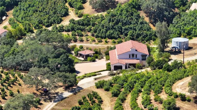 an aerial view of house with yard