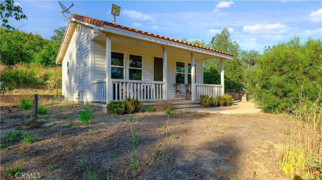 38149 De Luz Road Fallbrook, CA 92028 - Photo 25 of 36 a view of a house with backyard and garden