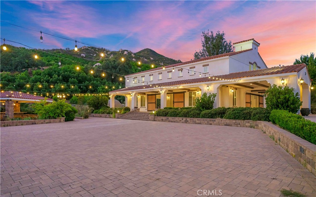 38149 De Luz Road Fallbrook, CA 92028 - Photo 32 of 36 a front view of a house with a yard and a garage