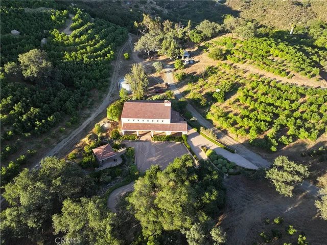 an aerial view of house with yard