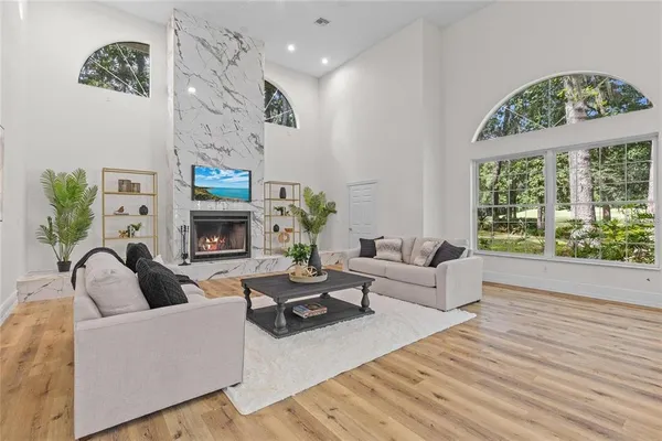 a living room with furniture and a large window