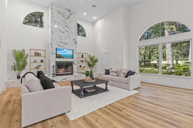 a living room with furniture and a large window