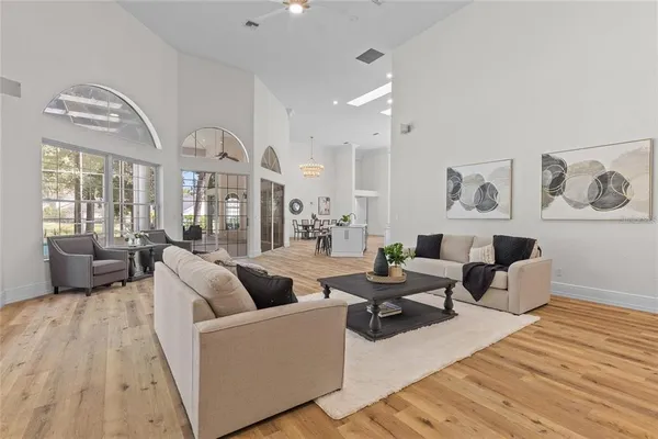 a view of a dining room with furniture wooden floor and a rug