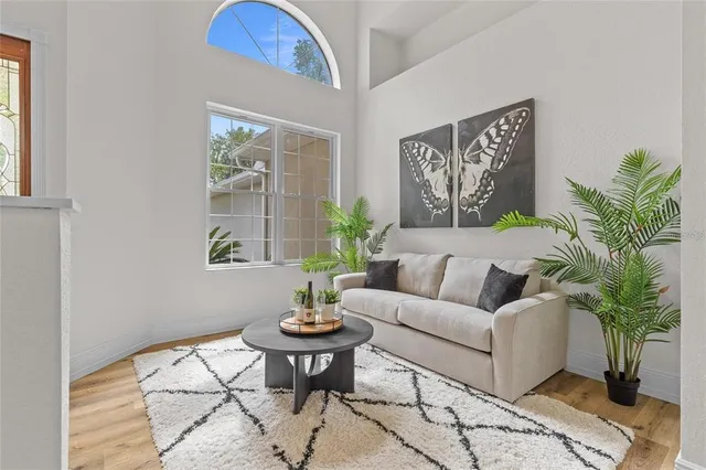 a view of a bedroom with a bed and a couch