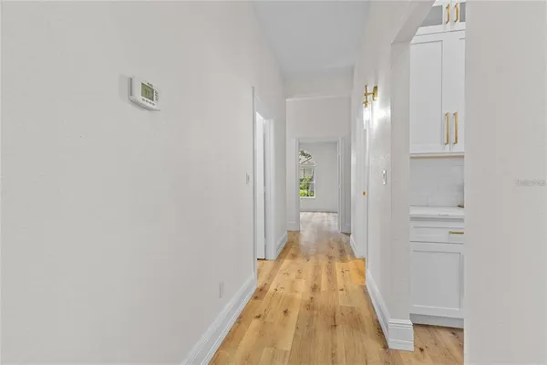 a spacious bathroom with a granite countertop sink a toilet and a shower