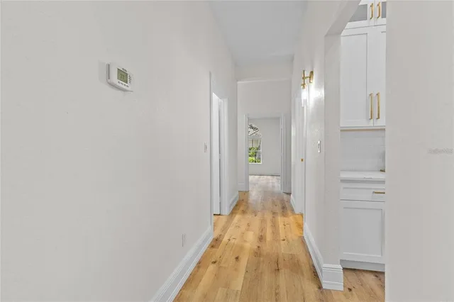 a spacious bathroom with a granite countertop sink a toilet and a shower