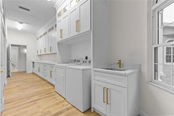 a bathroom with a granite countertop sink a toilet and a mirror