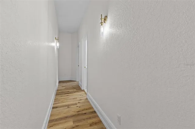 a view of a house with swimming pool and porch with furniture